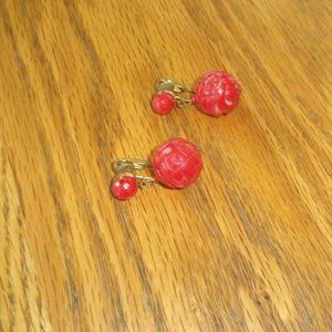 Dalsheim clip earrings gold tone red carved Lucite ball dangles